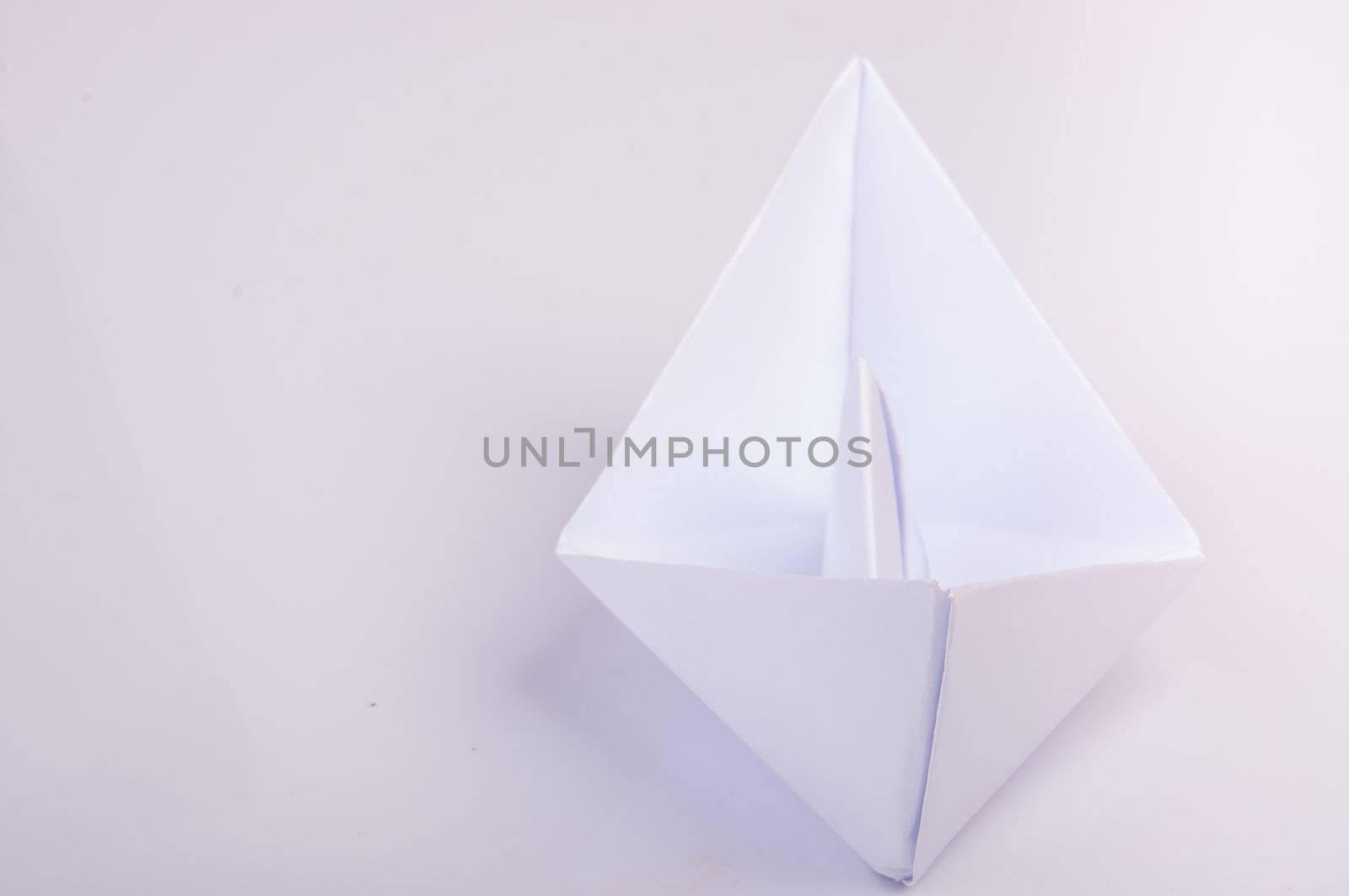 An image of white origami boat 