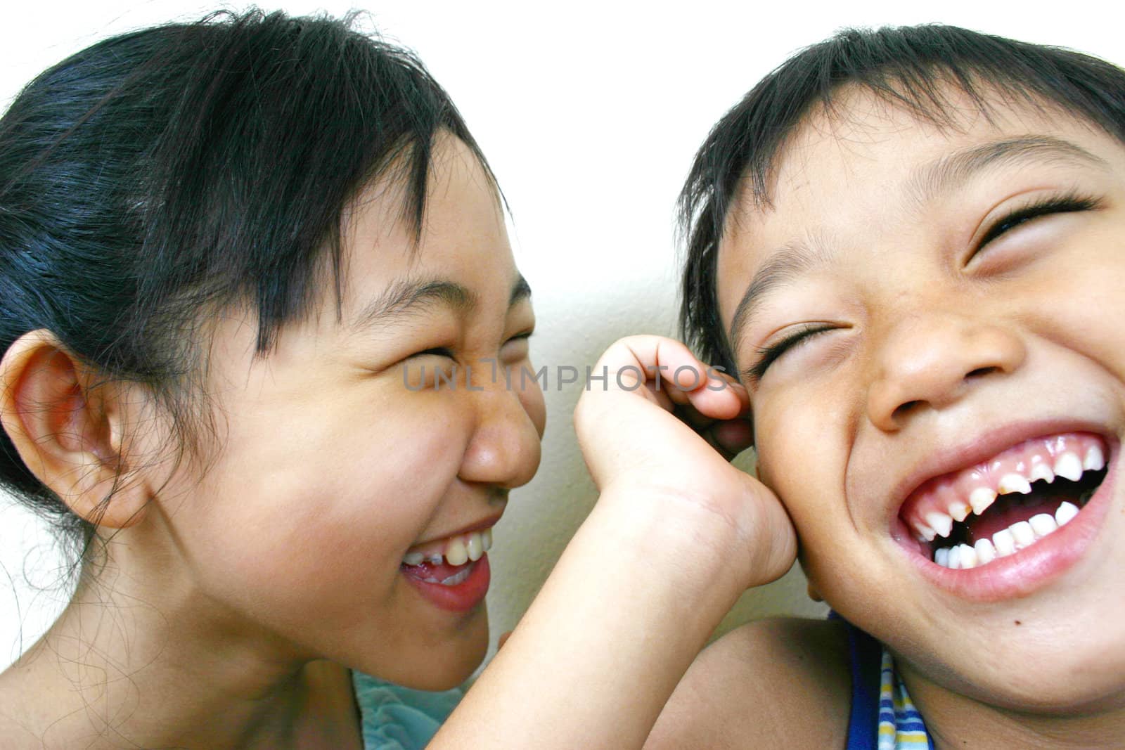 Two asian kids smiling