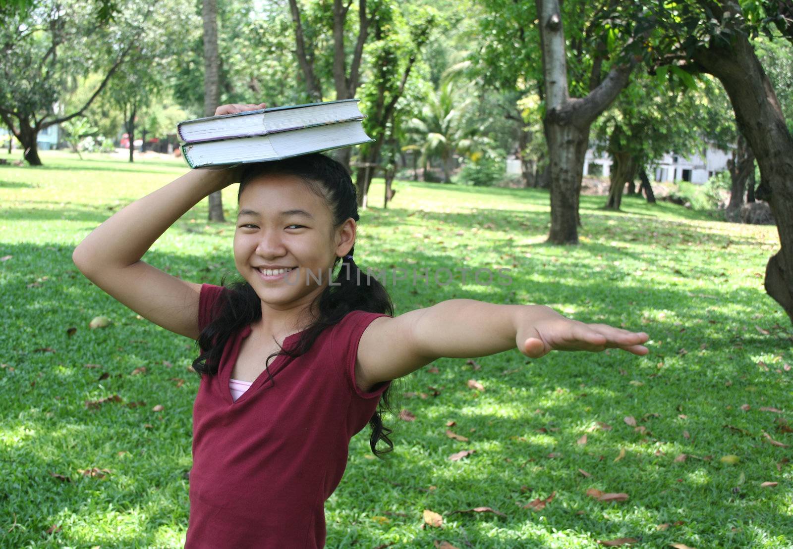 Girl in the park reading book