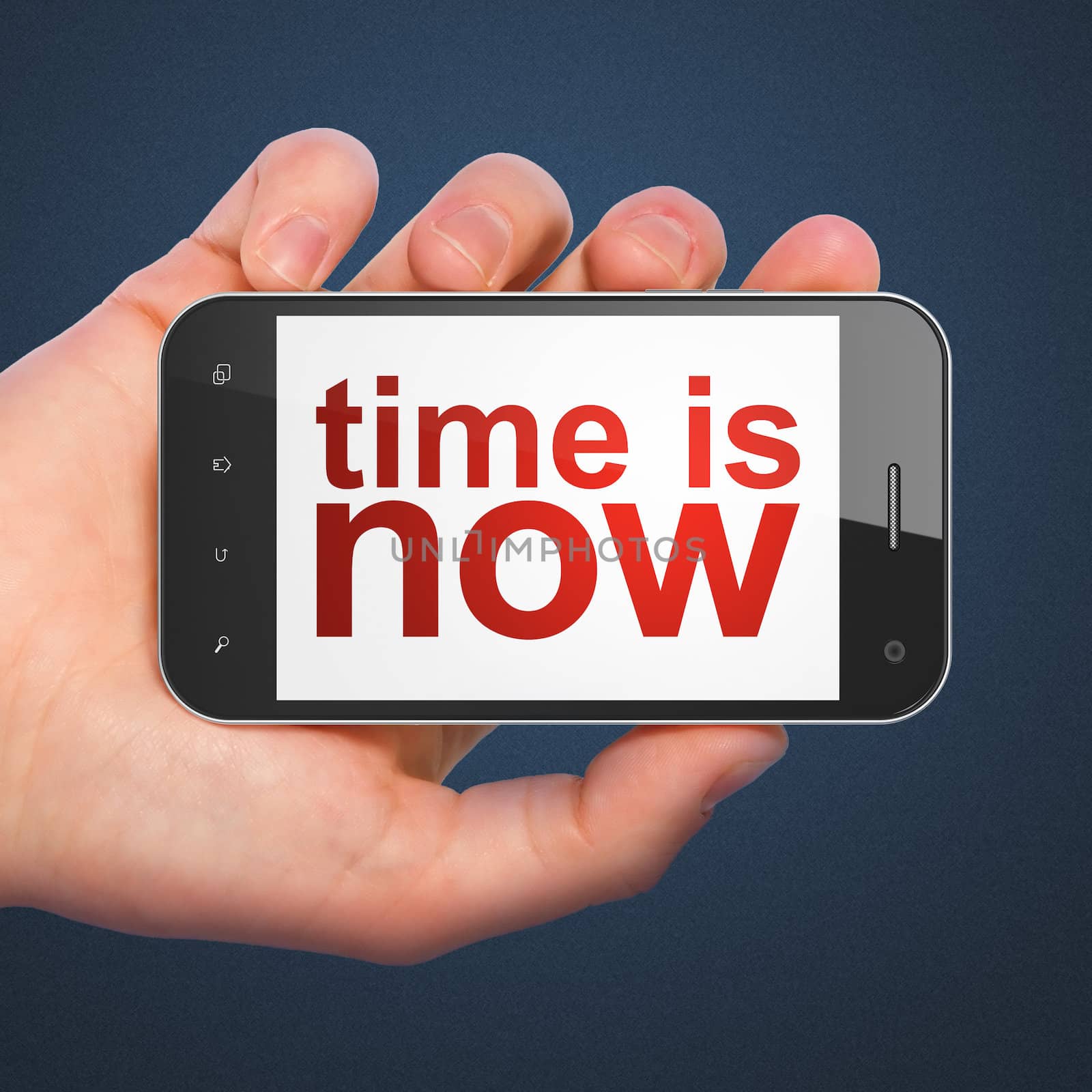 Time concept: hand holding smartphone with word Time is Now on display. Generic mobile smart phone in hand on Dark Blue background.