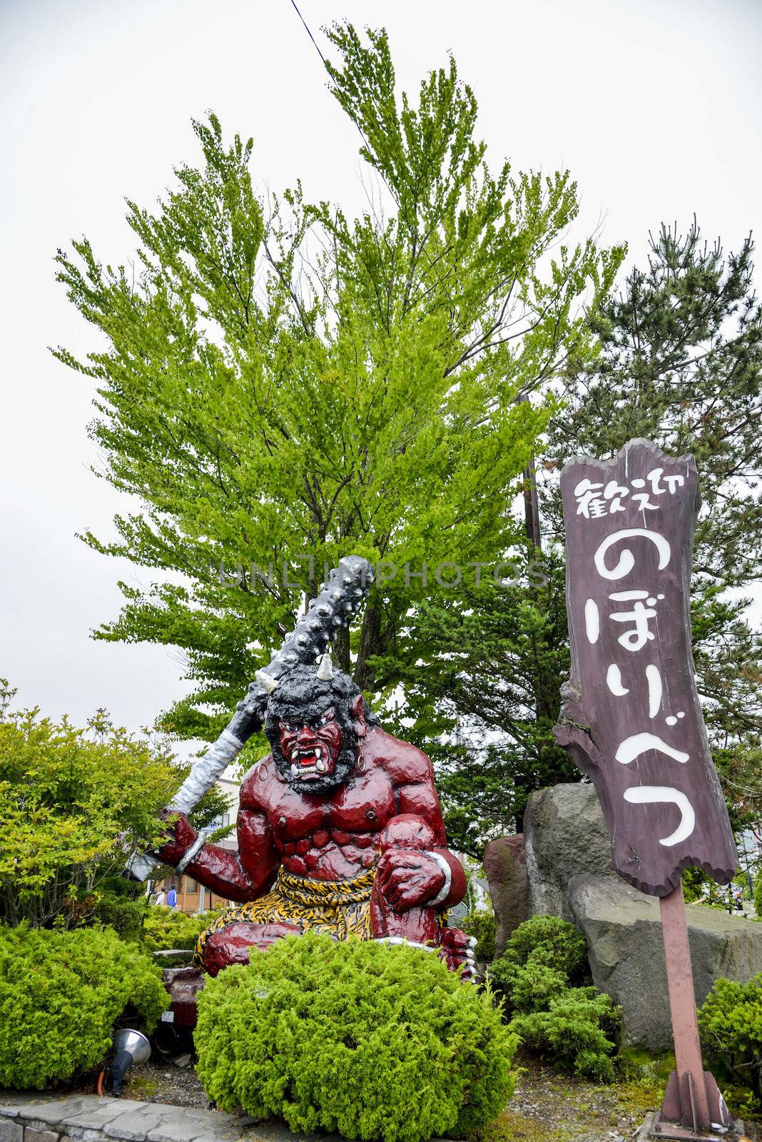 Red Giant statue in Noboribetsu Japan by gjeerawut