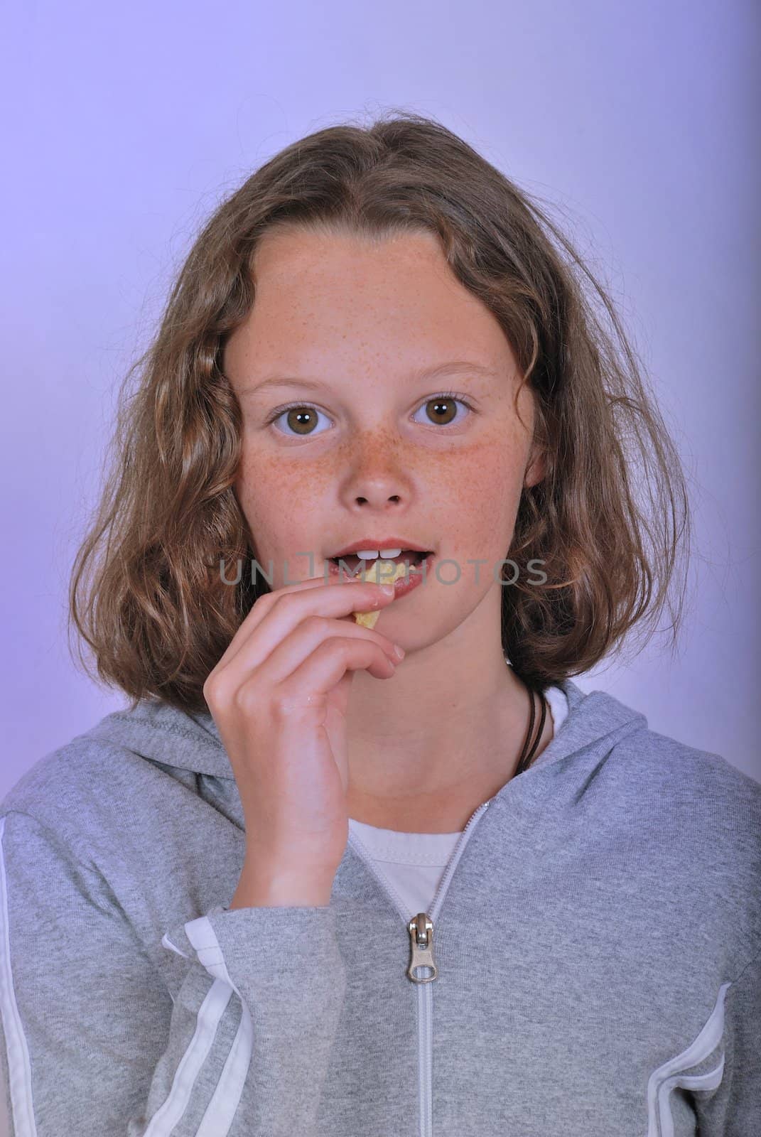 Girl eating chip