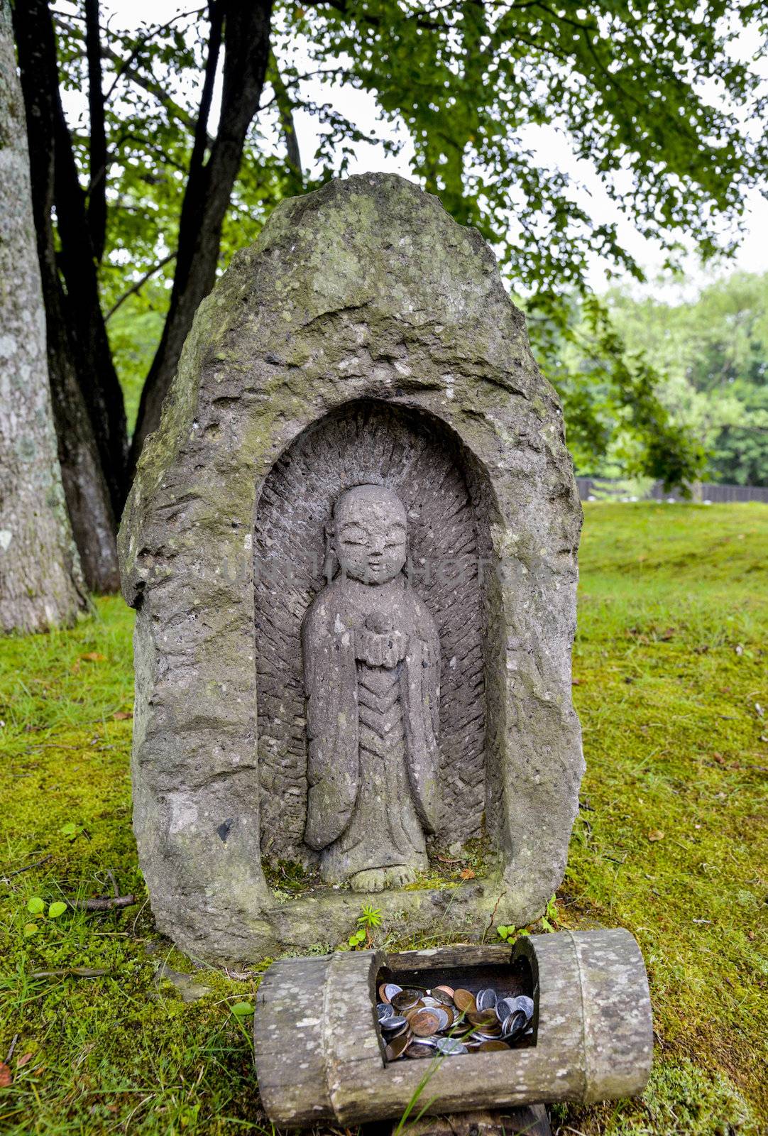 A little stone monk in Japan by gjeerawut