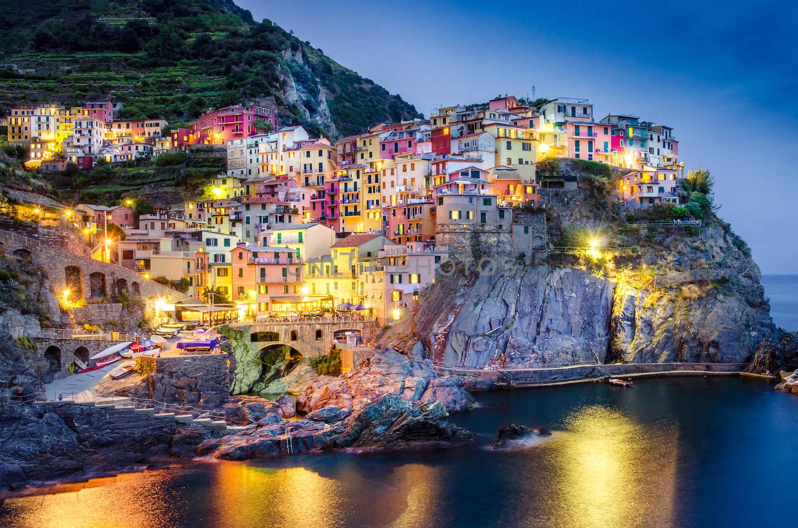 Scenic night view of colorful village Manarola in Cinque Terre by martinm303