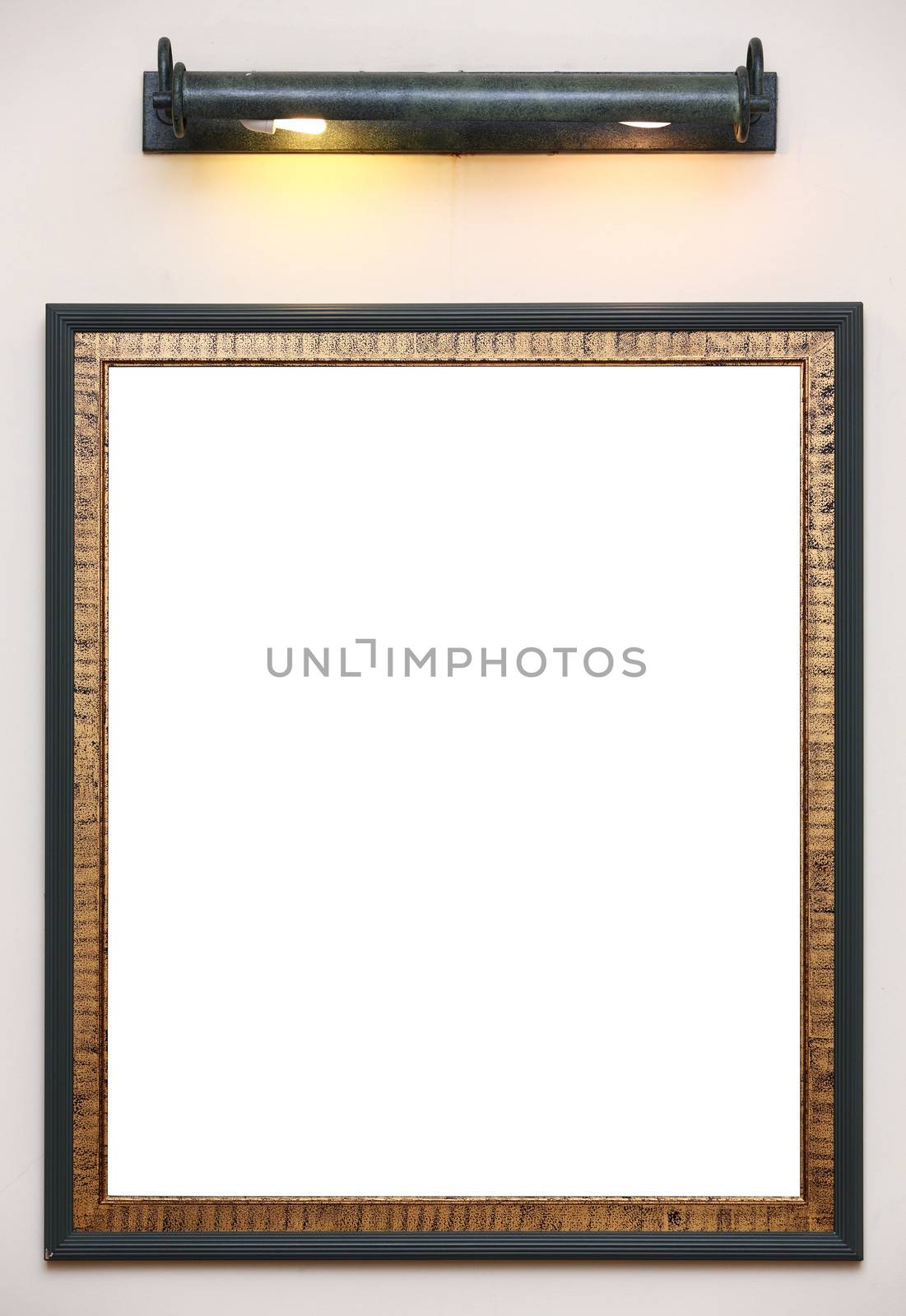 Photo frame on wall with lamp above
