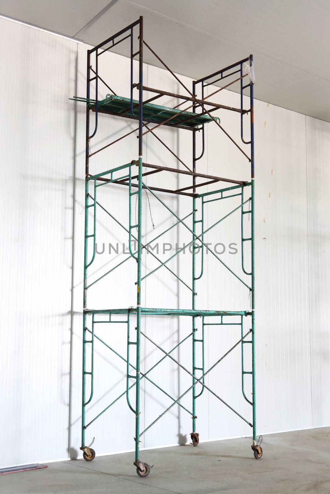 Iron scaffold with wheel in warehouse