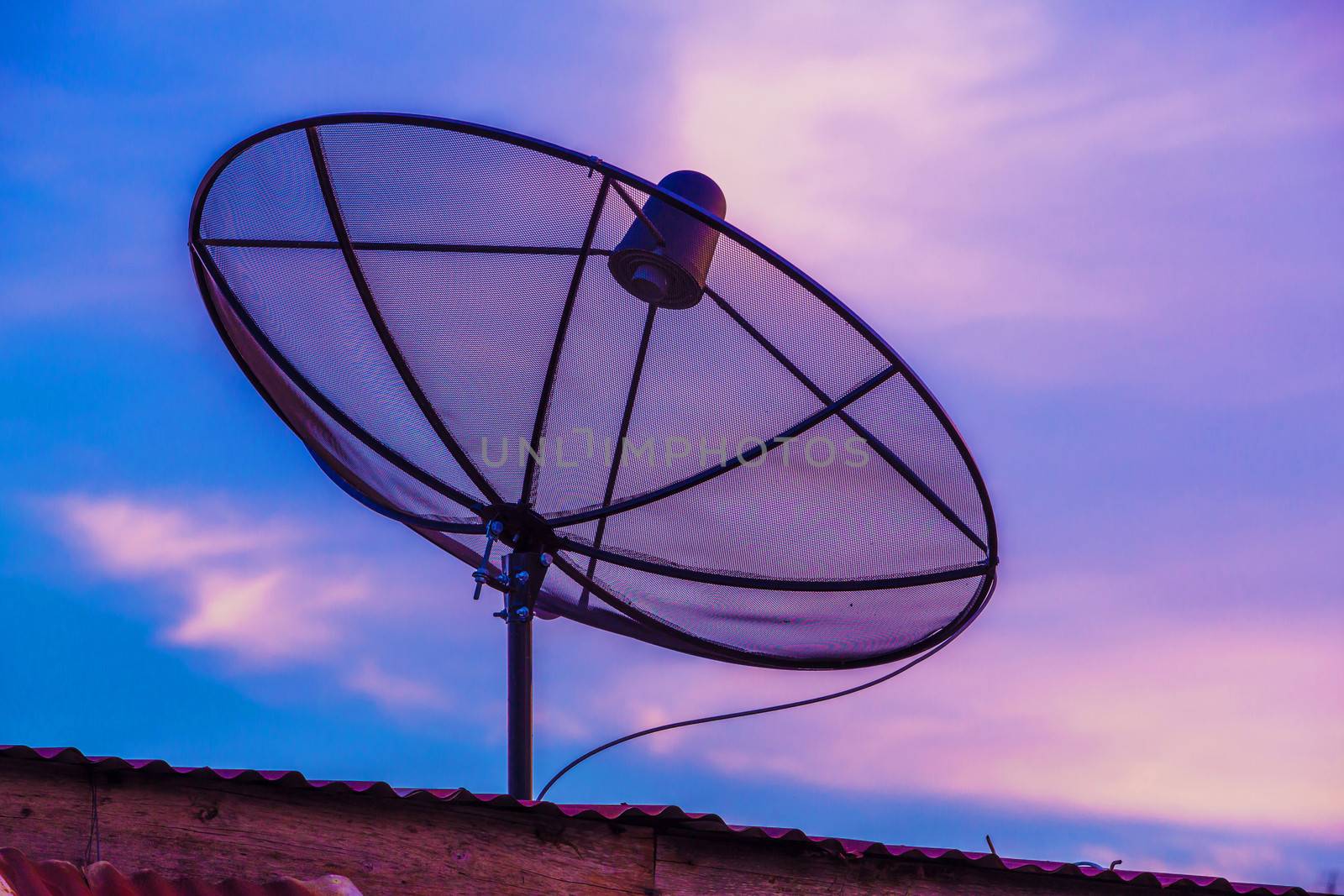 Television Satellite dish in twilight sky