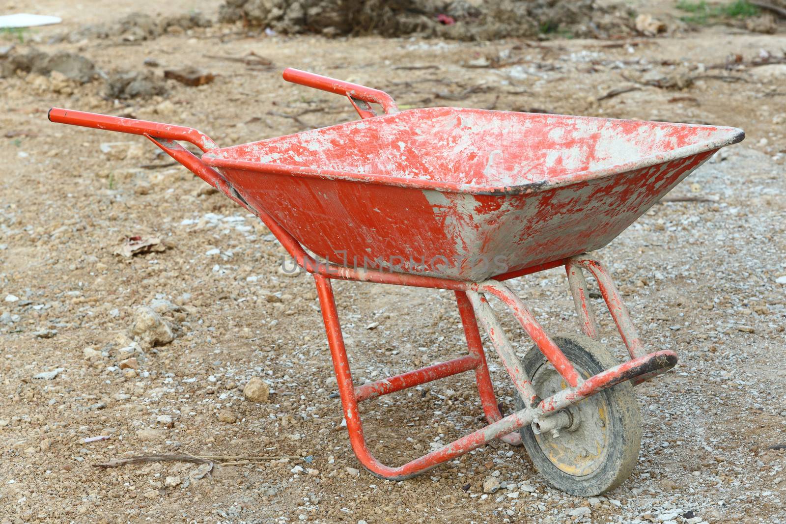 Thai red color construction wheelbarrow in site