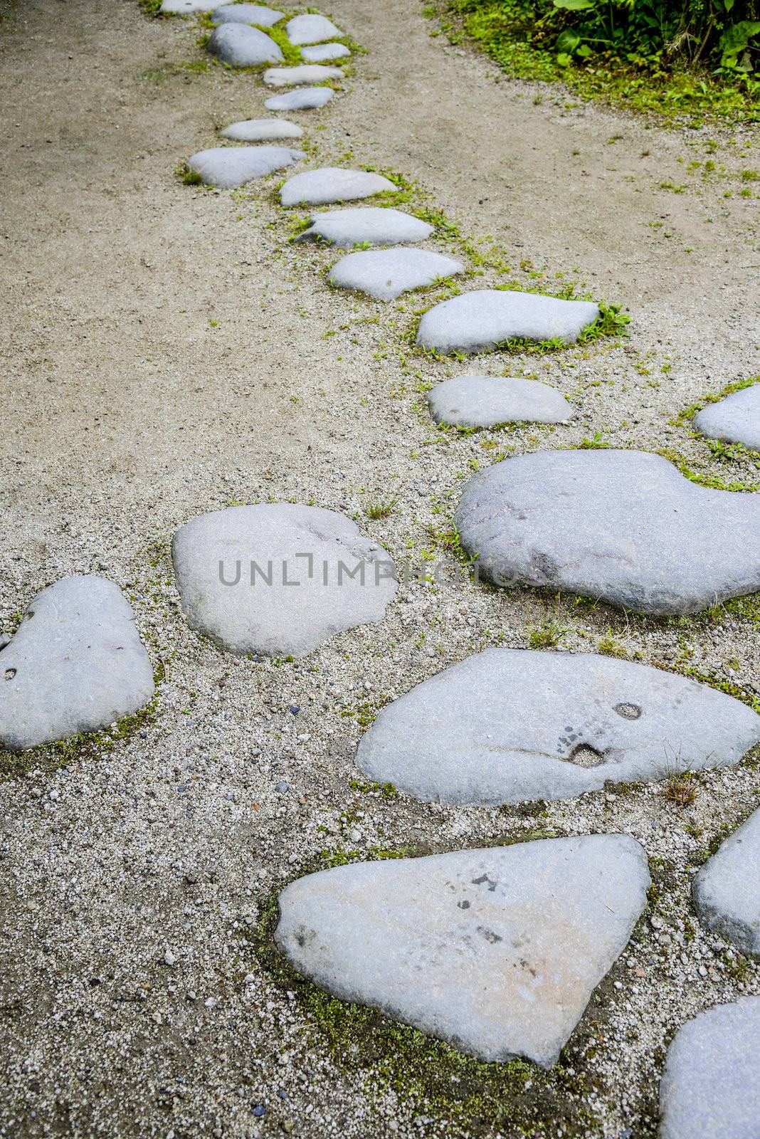 Stone steps in the garden by gjeerawut