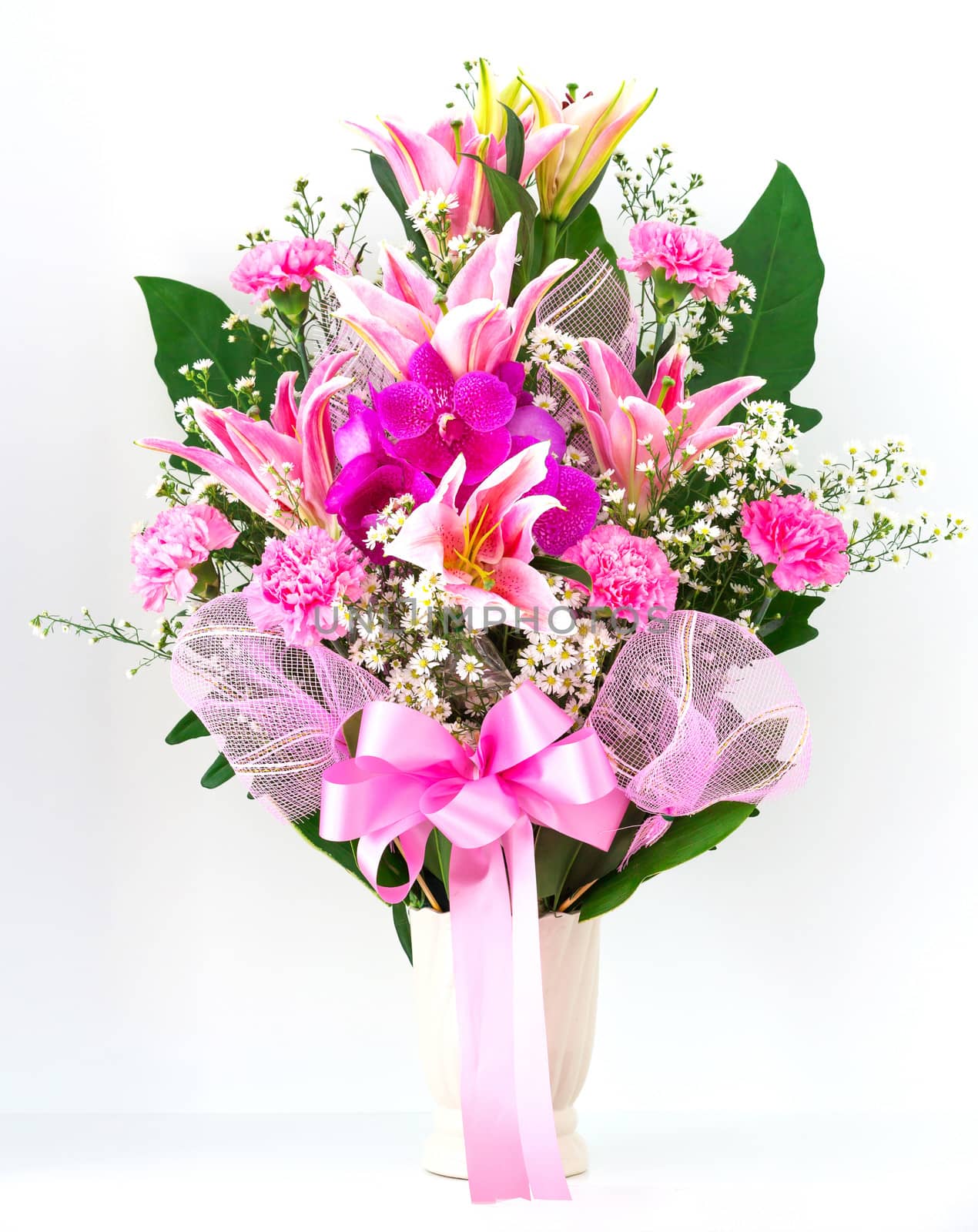 Bouquet of canation lily and orchid in a vase