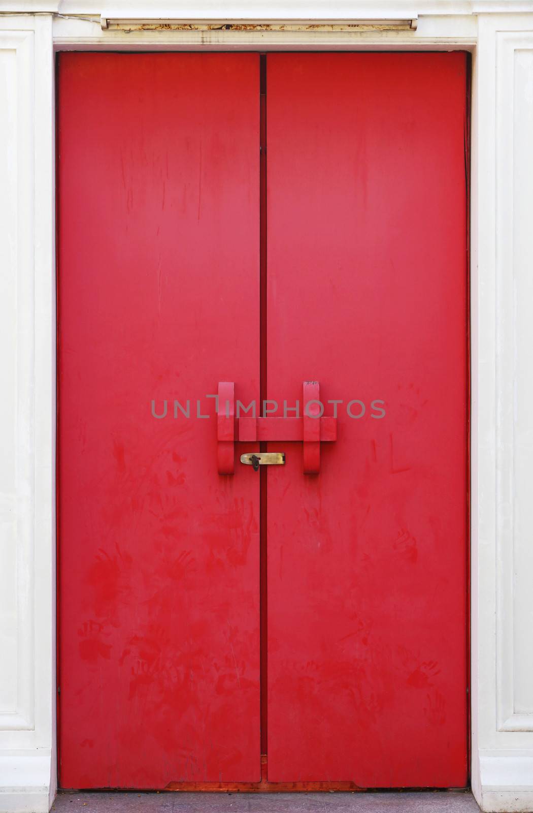 Old red color wooden door in Thai temple