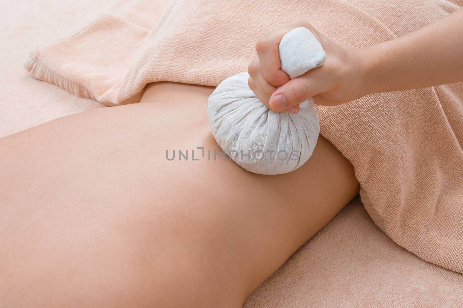 Herbal compress ball massage in Thai spa