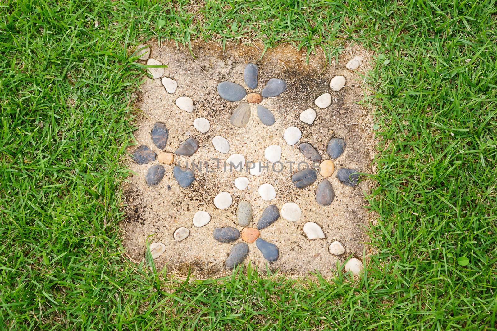 Stone decoration with concrete block on lawn
