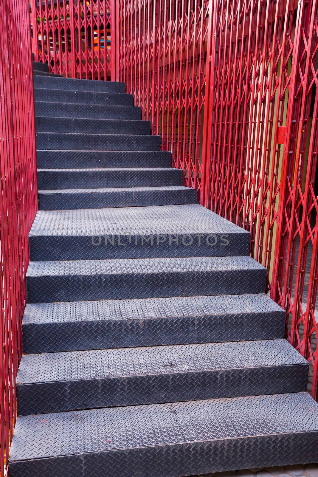 Black iron sheet staircase and red iron fence 