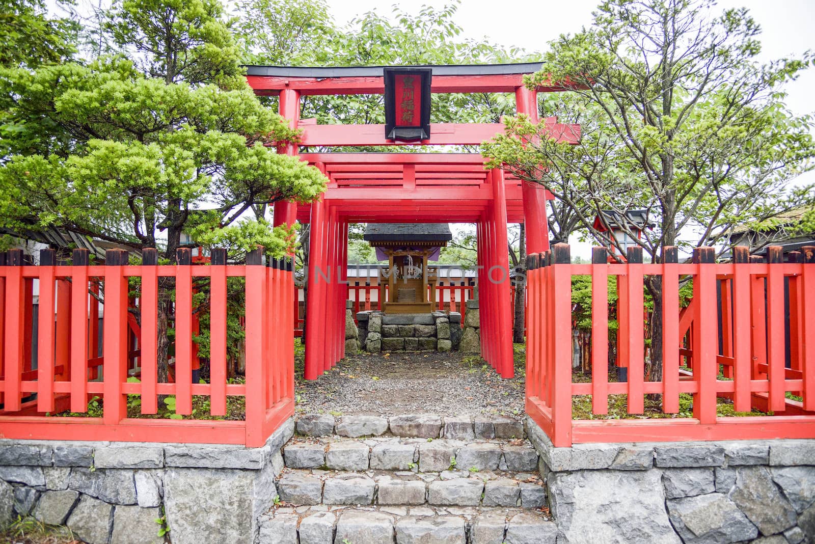 Small shrine with red Torii in Japanese style1 by gjeerawut