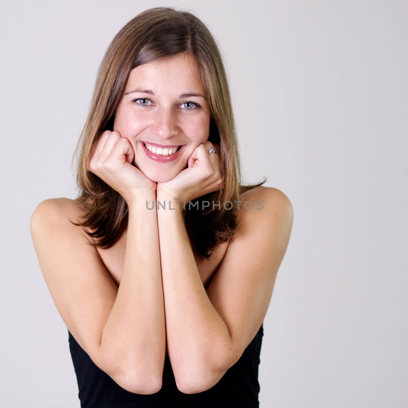 Closeup portrait of a happy young woman smiling