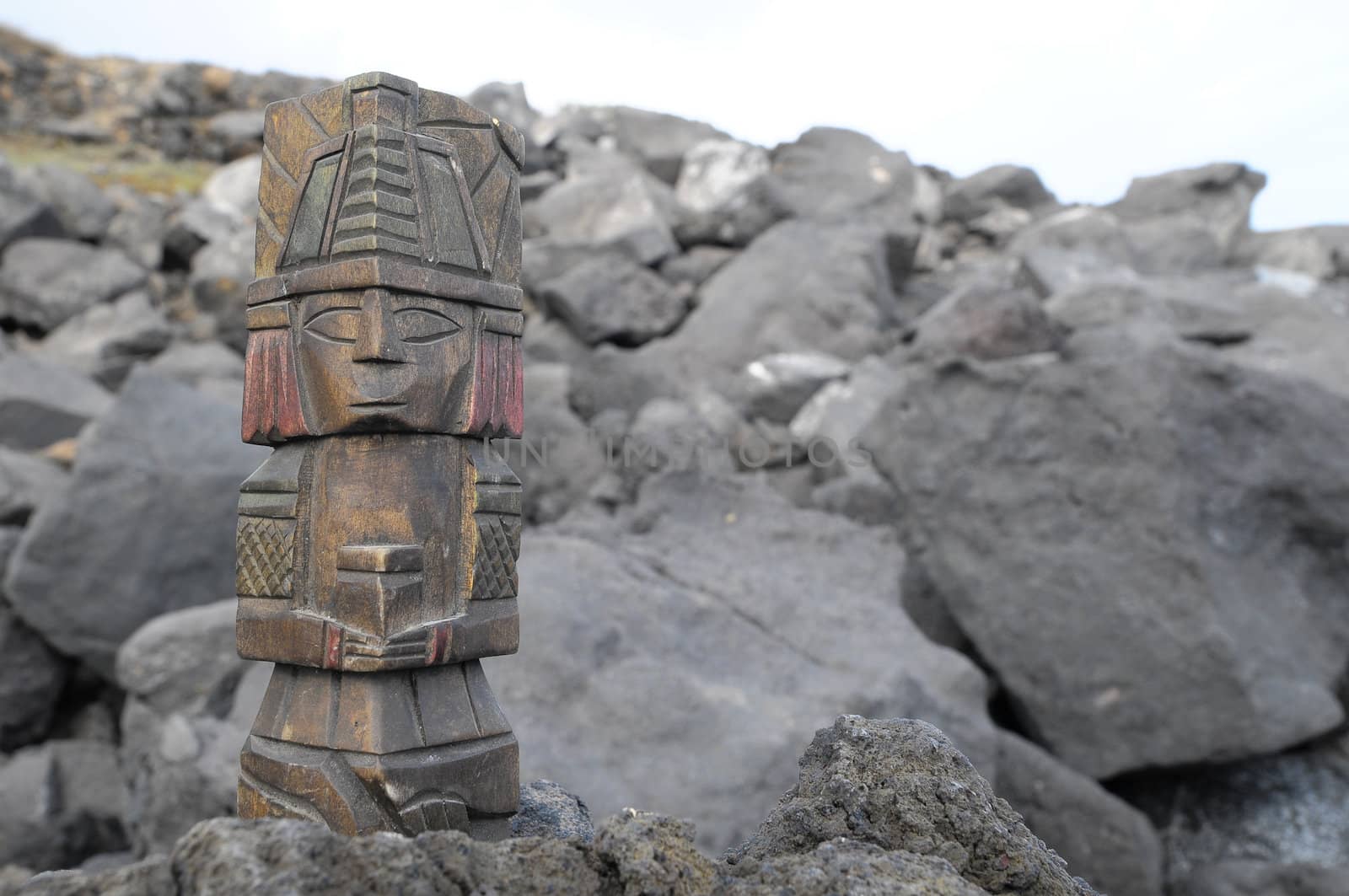 Ancient Maya Statue on the Rocks near the Ocean