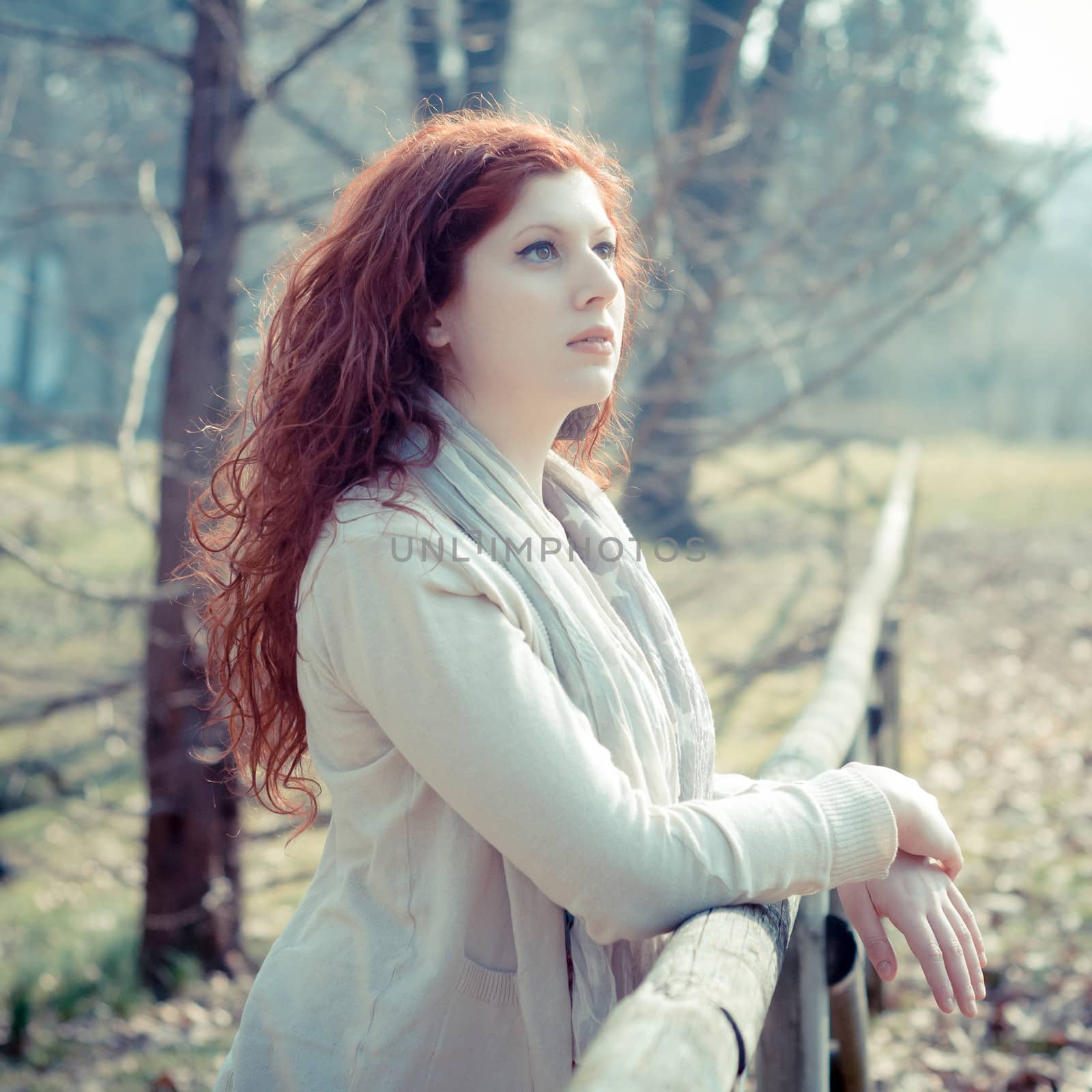 beautiful young woman posing in the park by peus