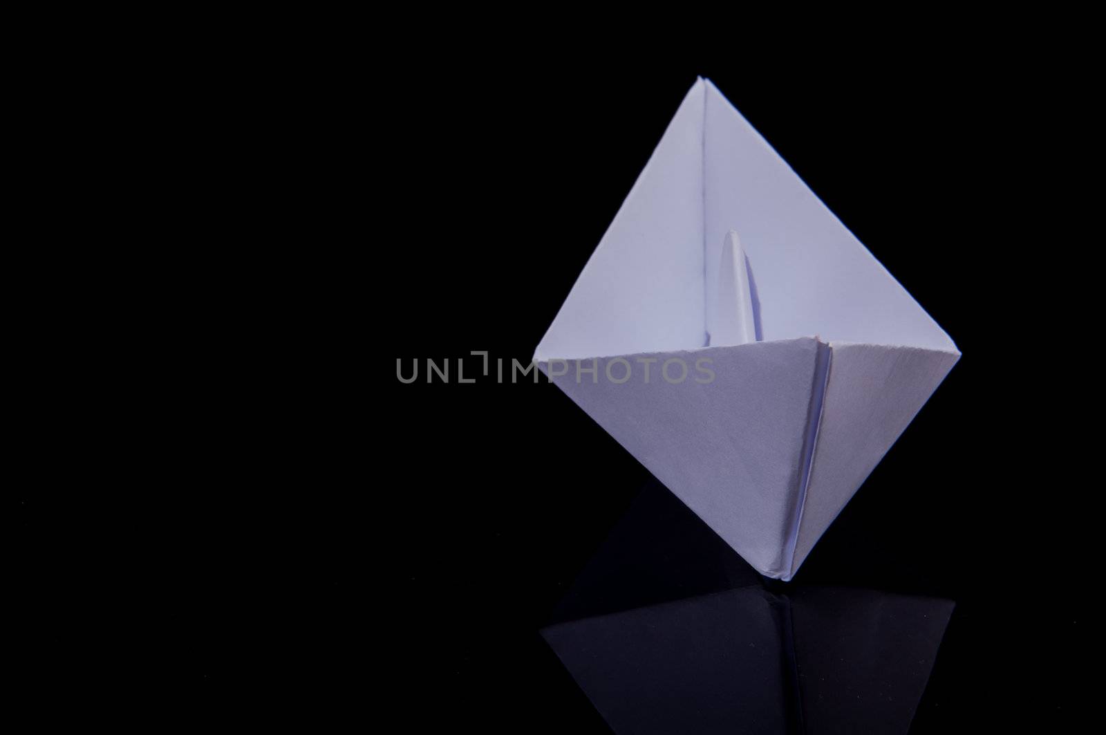 An image of white origami boat 