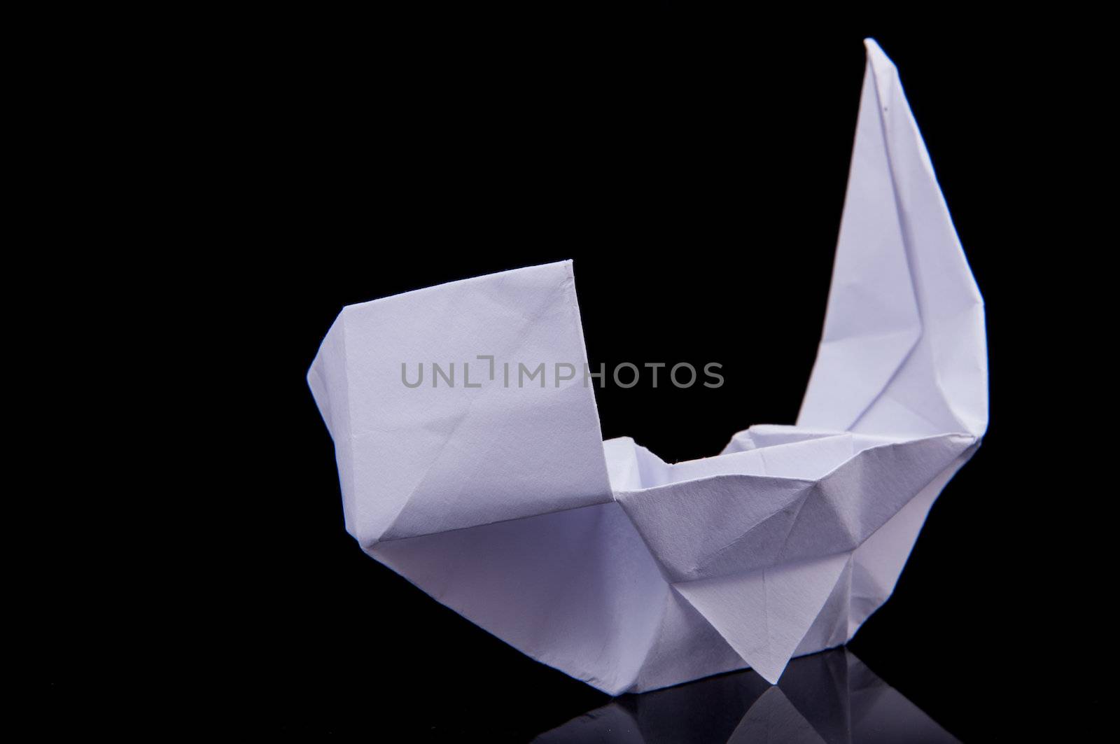 An image of white origami boat 