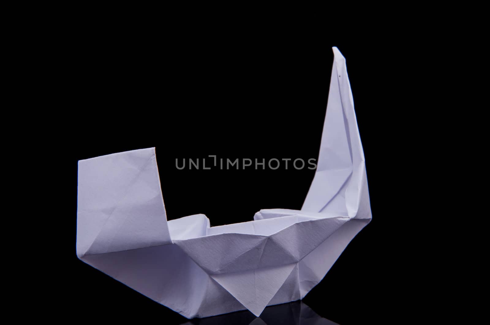 An image of white origami boat 