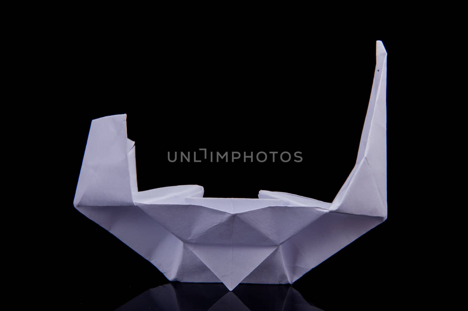 An image of white origami boat 