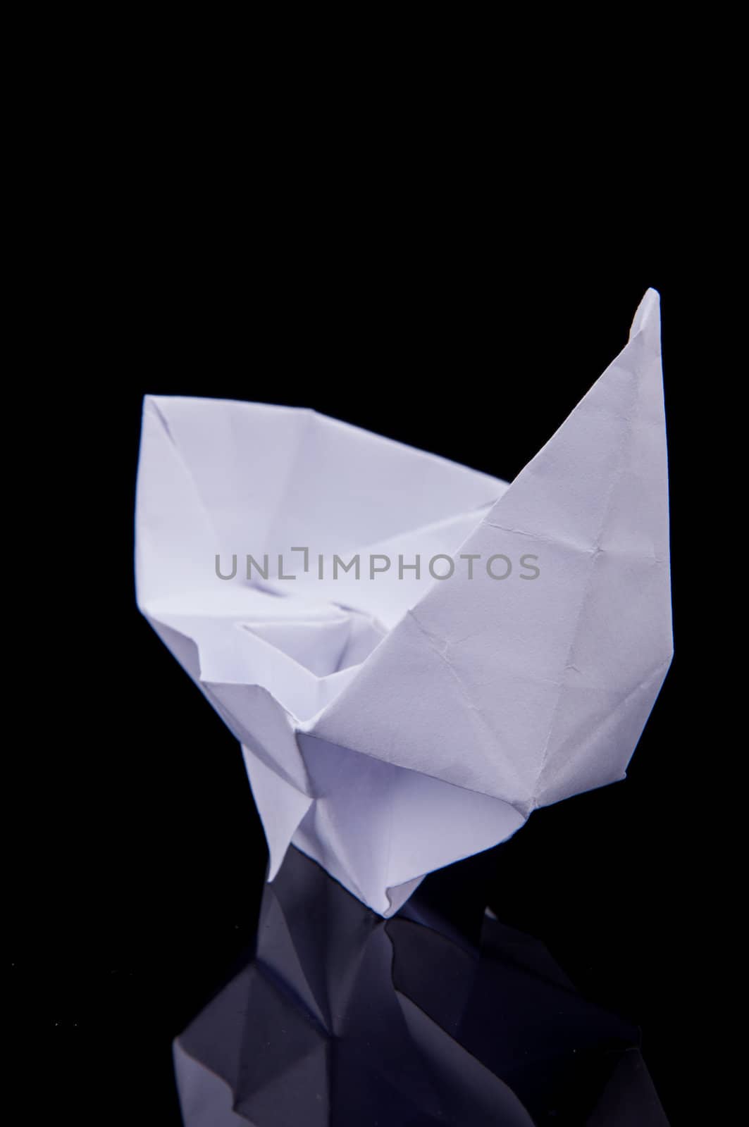 An image of white origami boat 