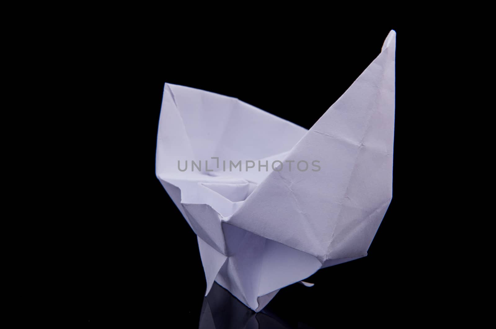 An image of white origami boat 