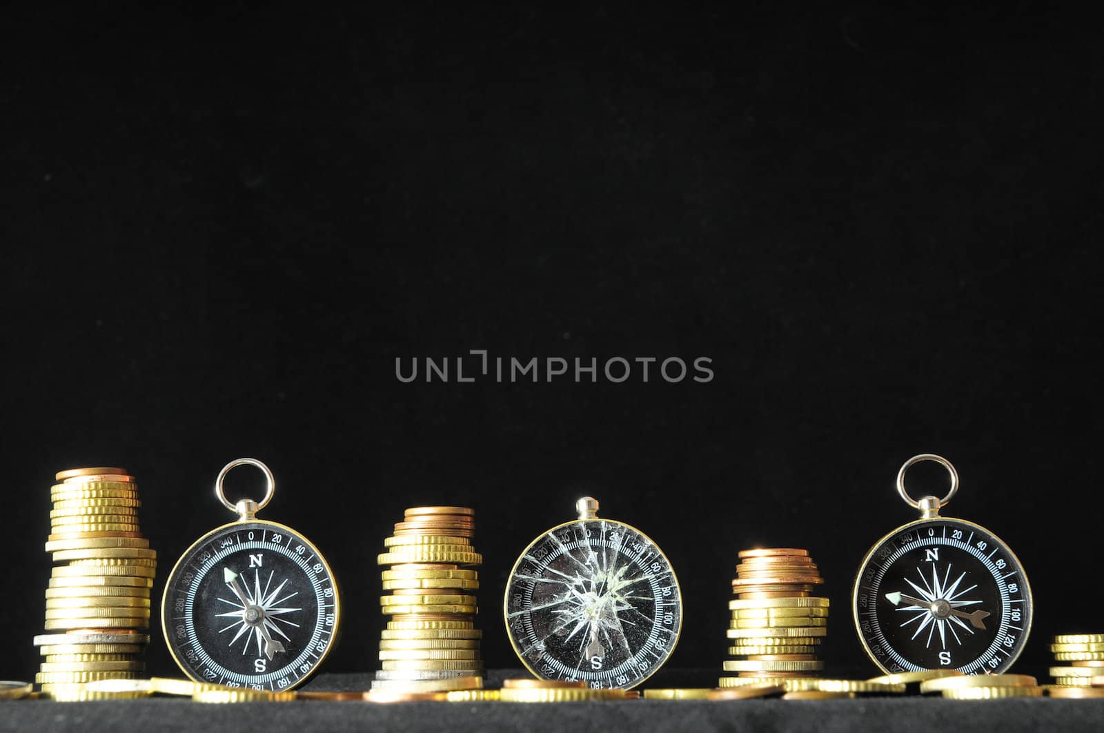 Orientation in  Business Compass and Money on a Black Background