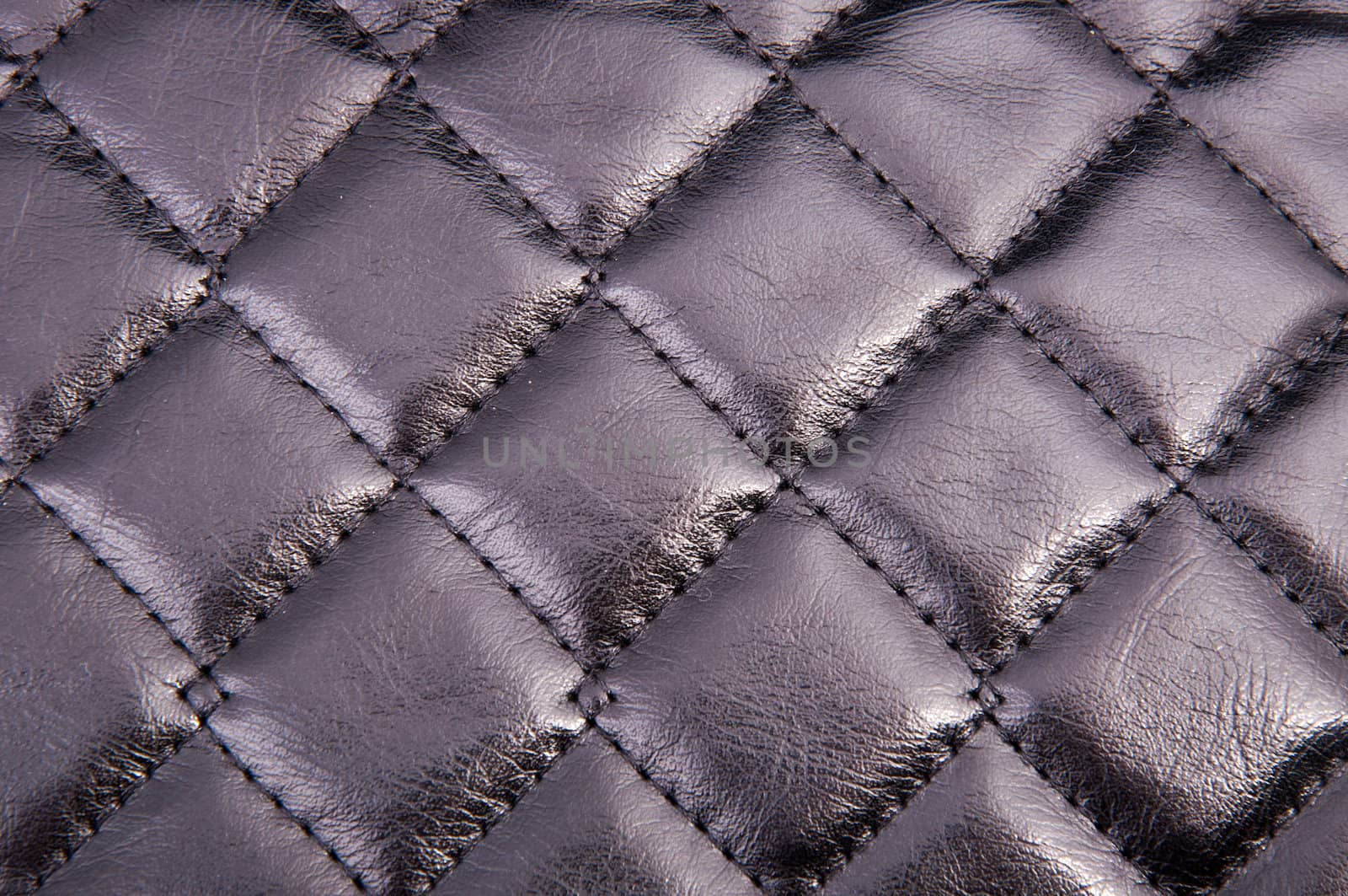 An image of squared black leather background