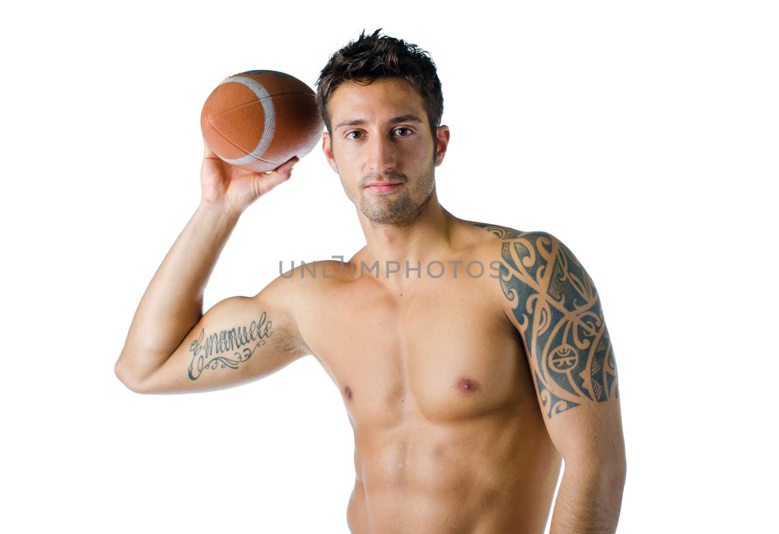 Attractive, fit, shirtless young man holding american football ball, isolated on white