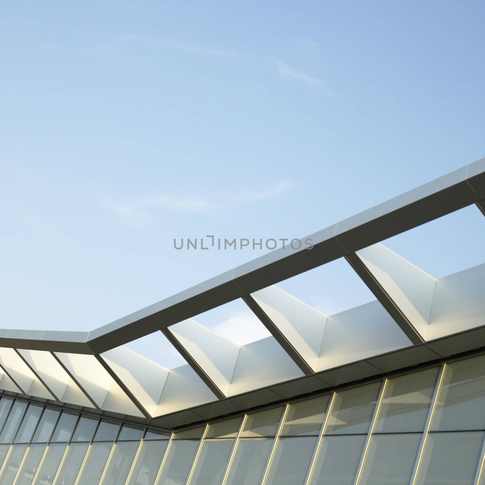 Modern architectural building awning against blue sky