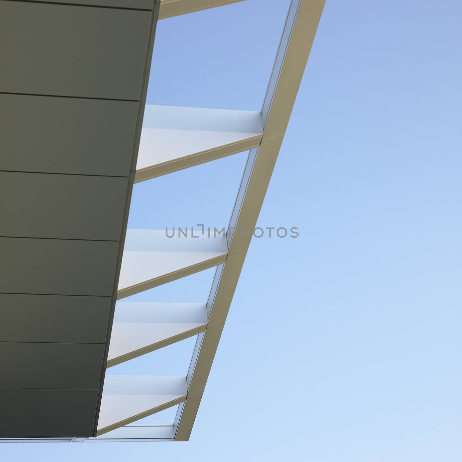 Modern architectural building awning against blue sky