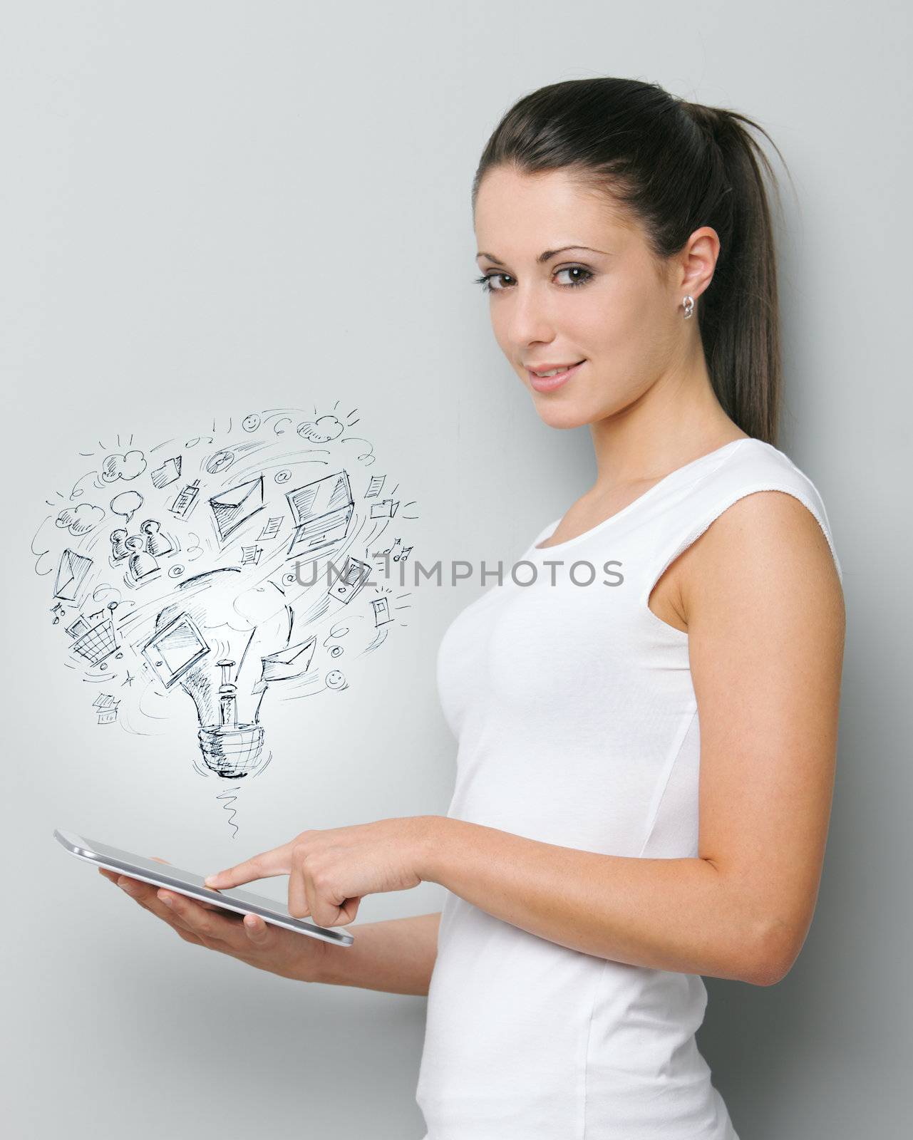 A beautiful young woman working on her digital touchpad 