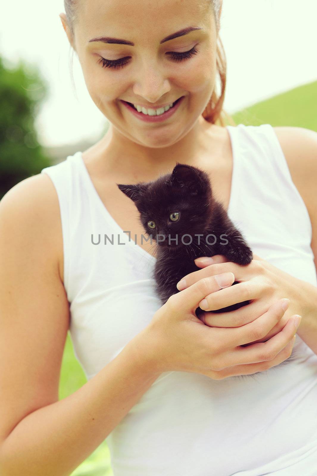 Beautiful girl and little cat by stokkete