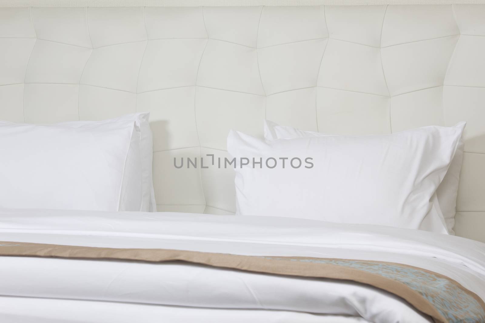 King sized bed in a luxury hotel room  by senkaya