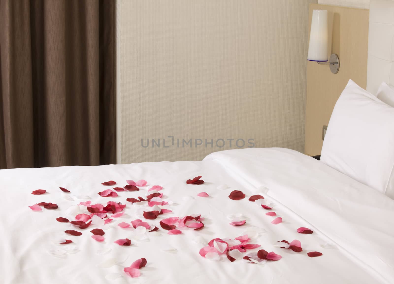 hotel room with big bed and red flowers