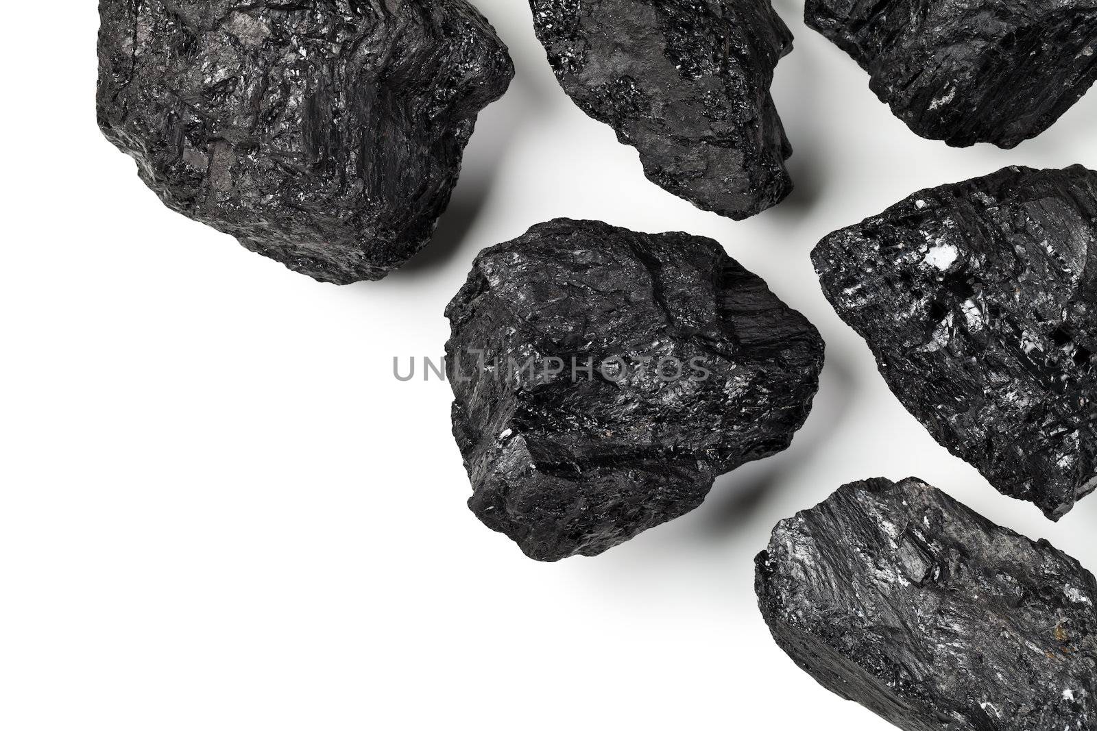 Coal on white background with copy space. Top view