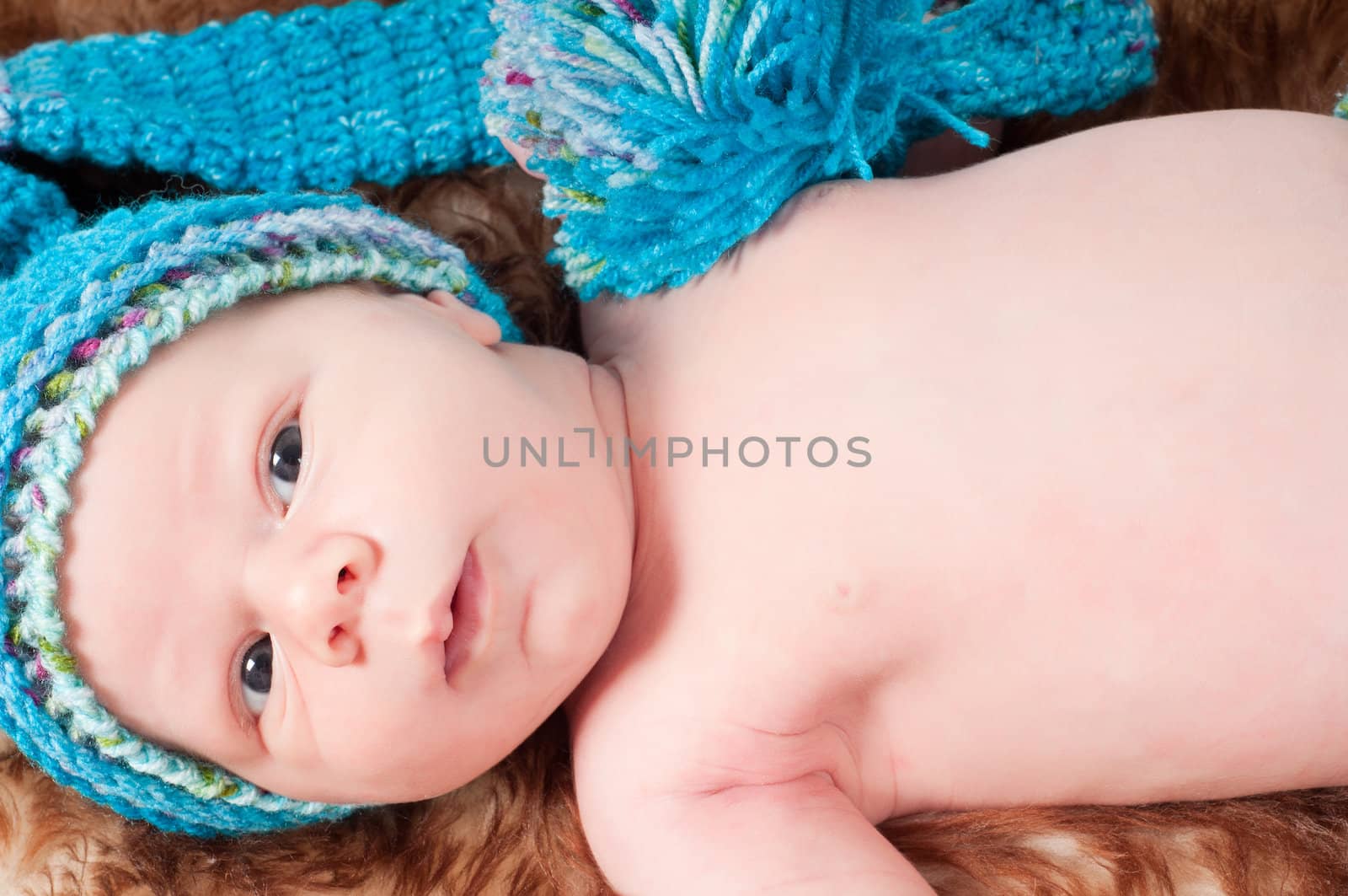 Newborn baby in blue knitted hat by anytka