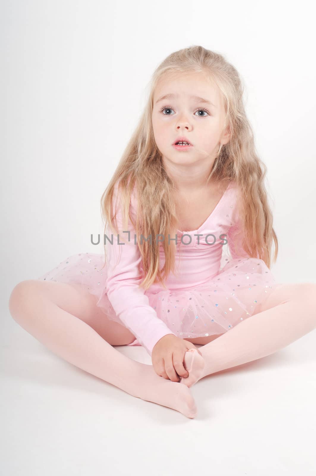 Studio shot of ballet dancer girl in pink