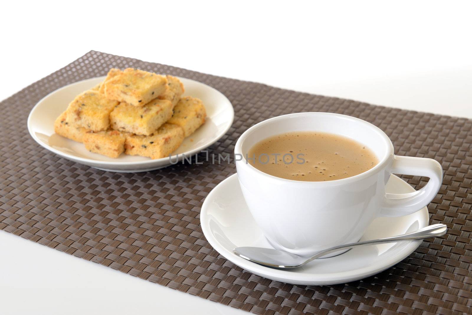 cup of hot coffee and biscuit isolated on white background