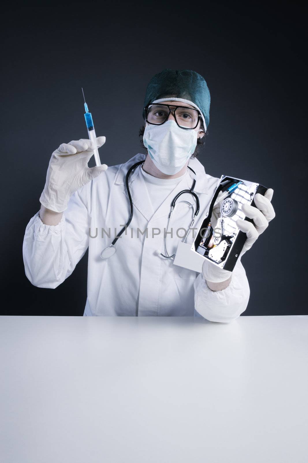 Computer virus concept. Technical / Doctor with syringe and hard disk