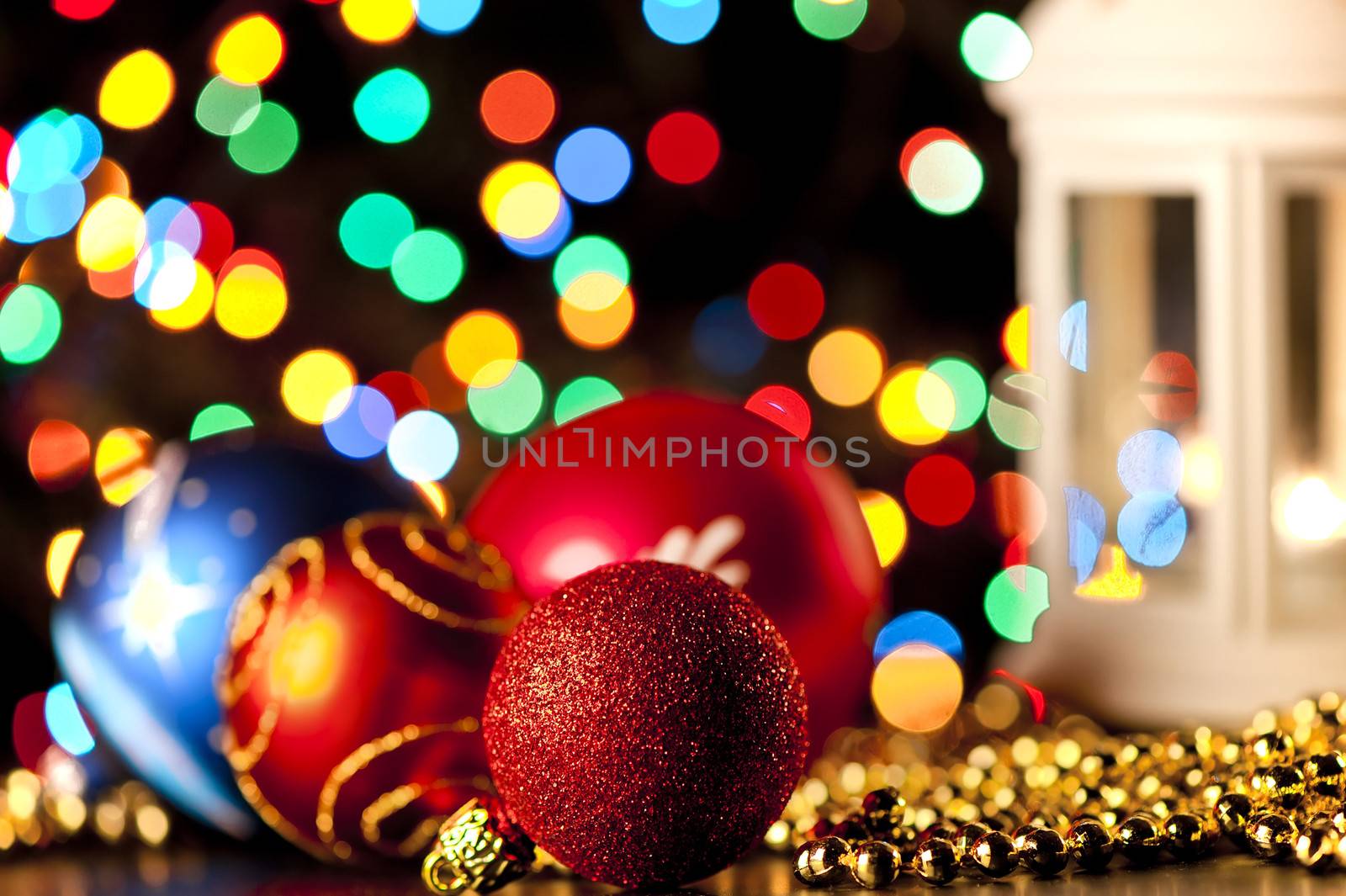 Christmas balls on the background of blurred lights garlands.