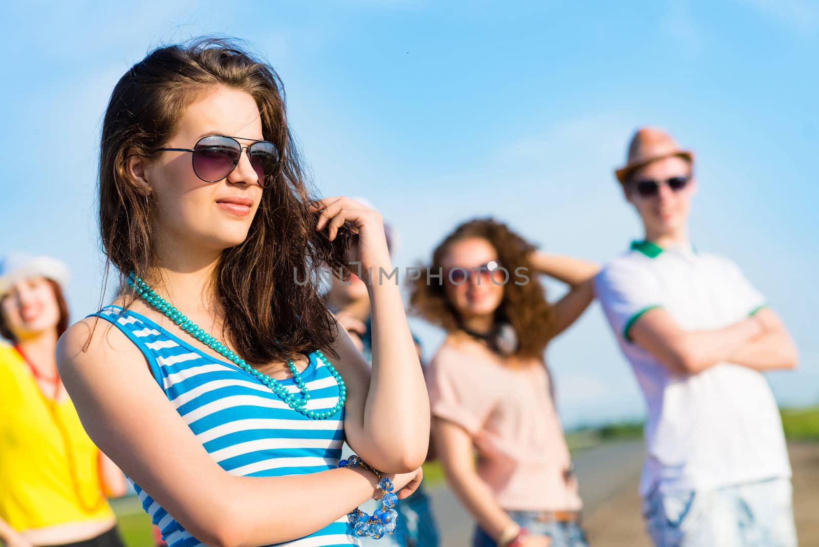 stylish young woman in sunglasses by adam121