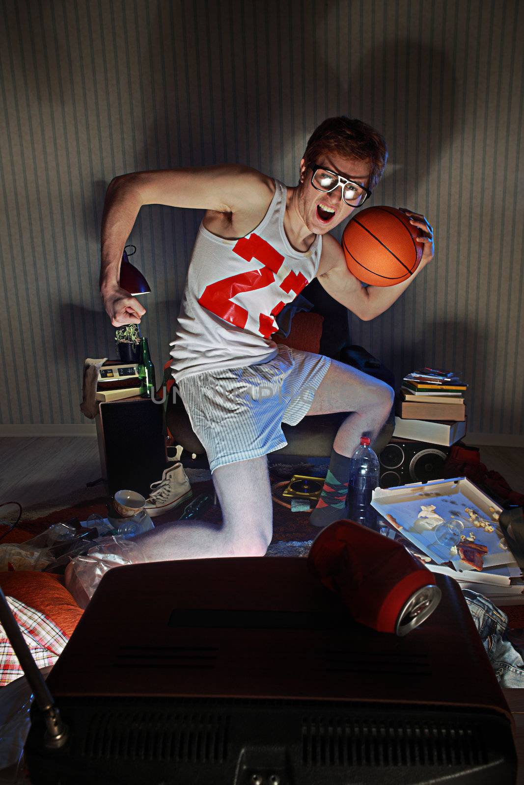 Nerdy excited basketball fans watching television celebrating the victory