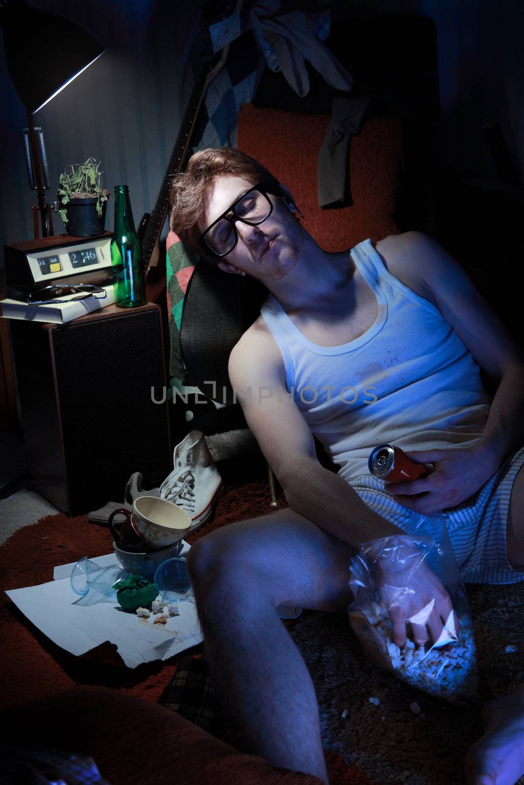 Guy in underwear lies slumped on the floor.