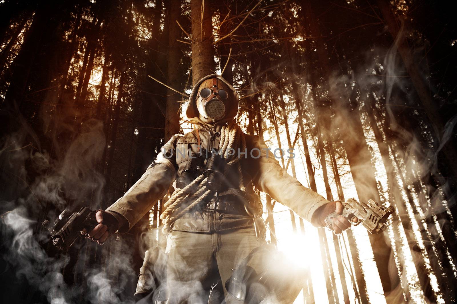Soldier wearing a gas mask in a forest