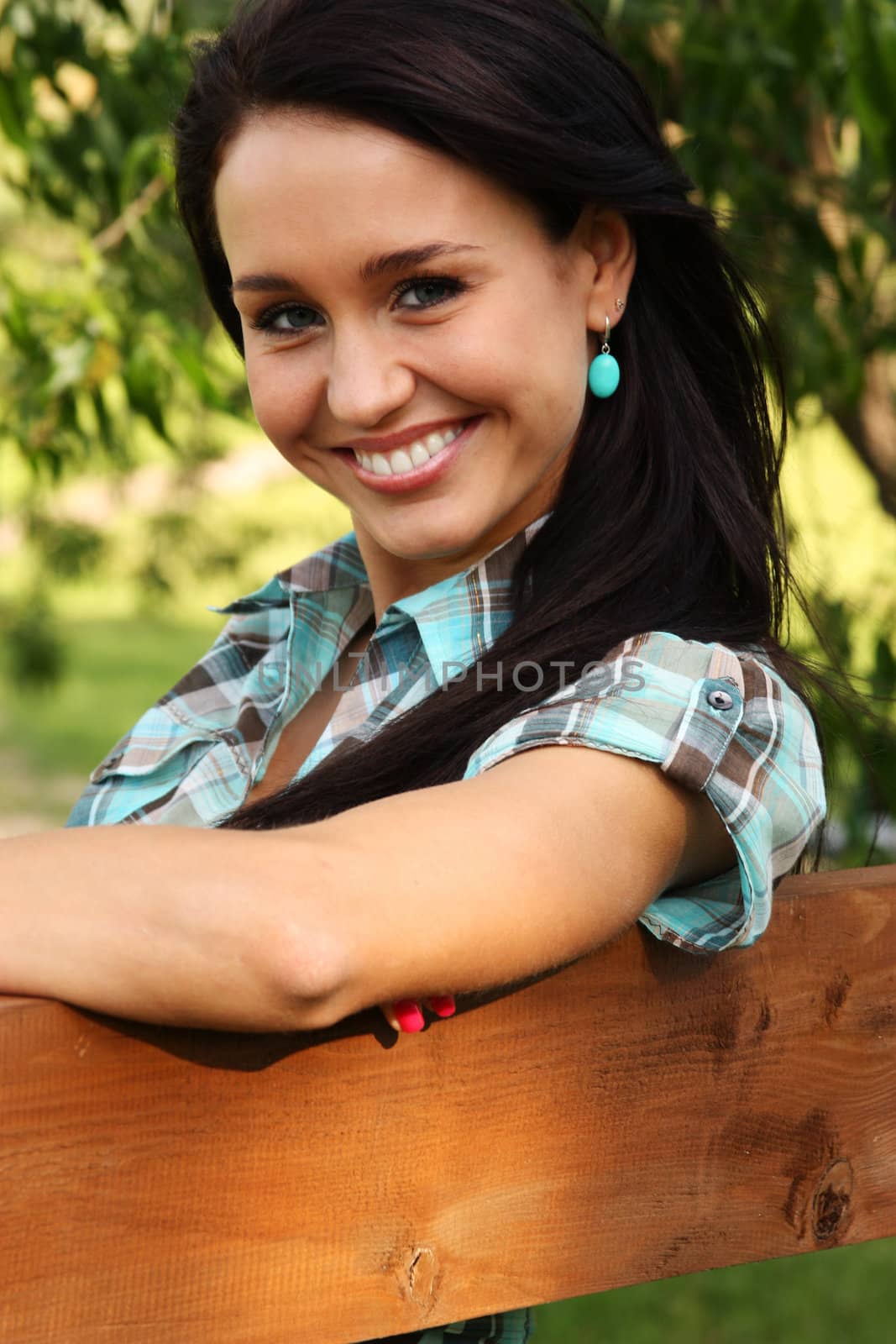 Happy young woman. Outdoor portrait by andersonrise