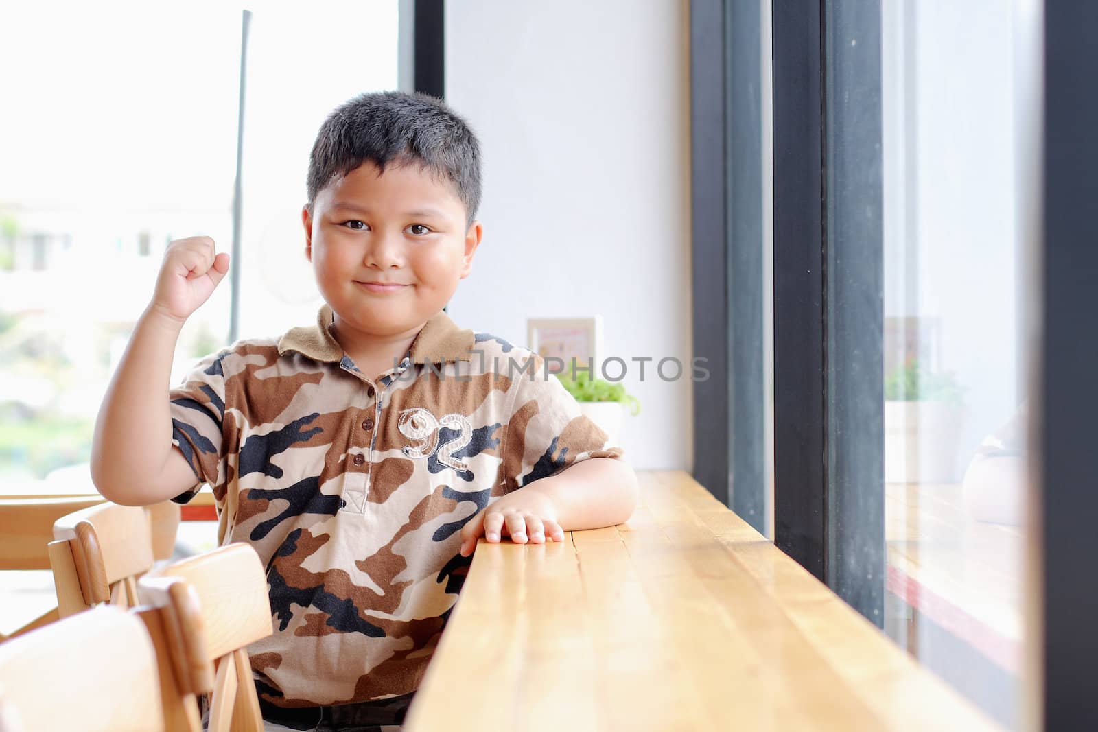 Boy with a cheerful expression.