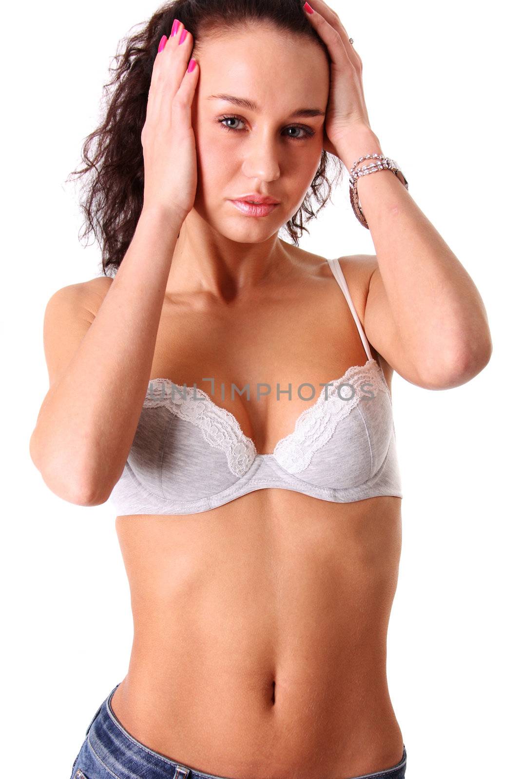 Young woman in jeans and sexy bra